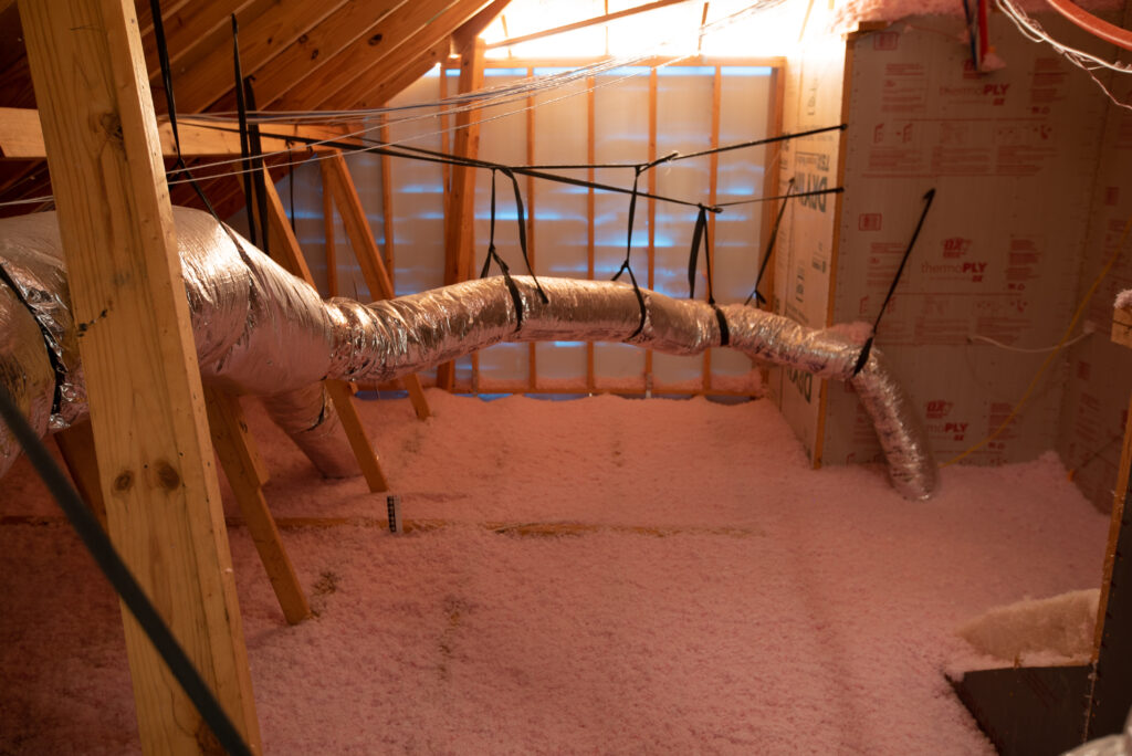 Attic installed with loose fill fiberglass insulation